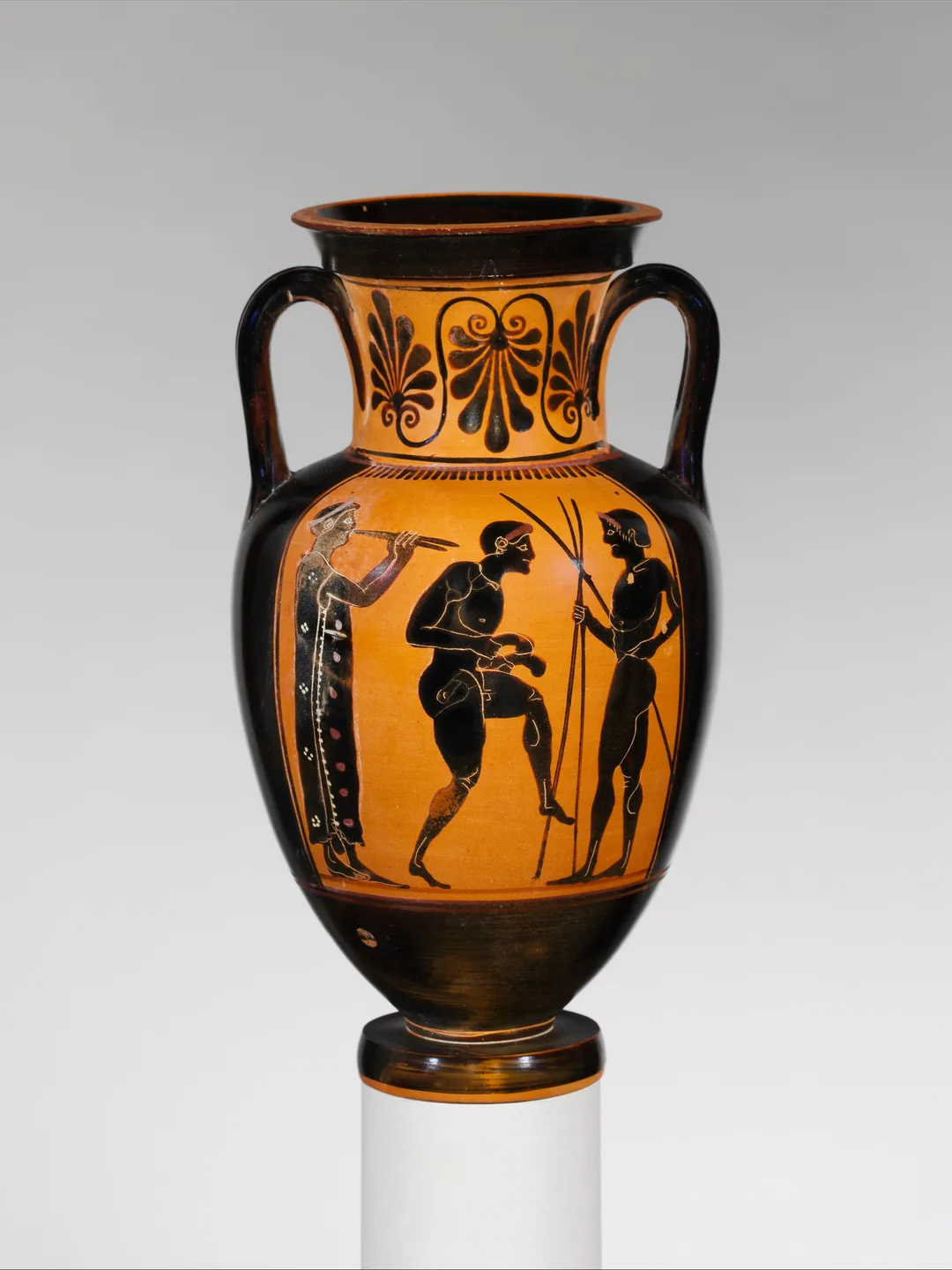Greek amphora with two athletes and an aulos player